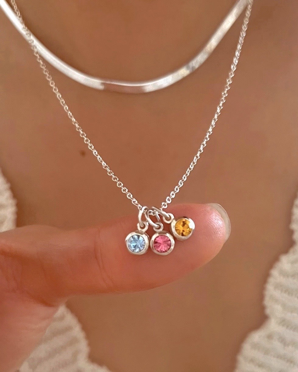 Sterling Silver Birthstone Necklace in March aquamarine birthstone, November Citrine birthstone and October pink tourmaline birthstone on a model