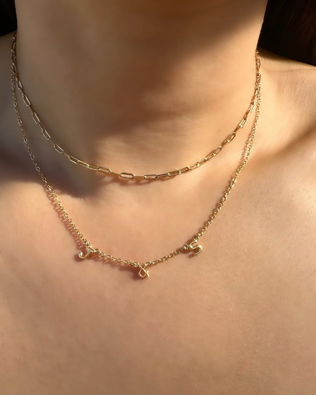 Gold You & Me Initial Necklace – Dainty 14K Gold Letter Necklace with Petite 5mm Initials on a model. Perfect Personalized Gift for Couples, Best Friends, or Family. Minimalist Custom Jewelry.