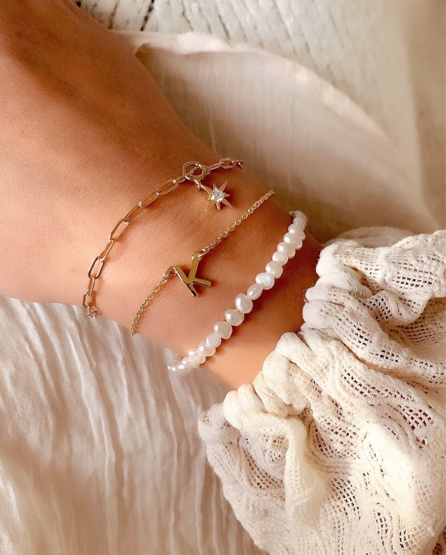 Customizable initial bracelet with the option to add up to 5 letters, gems or heart