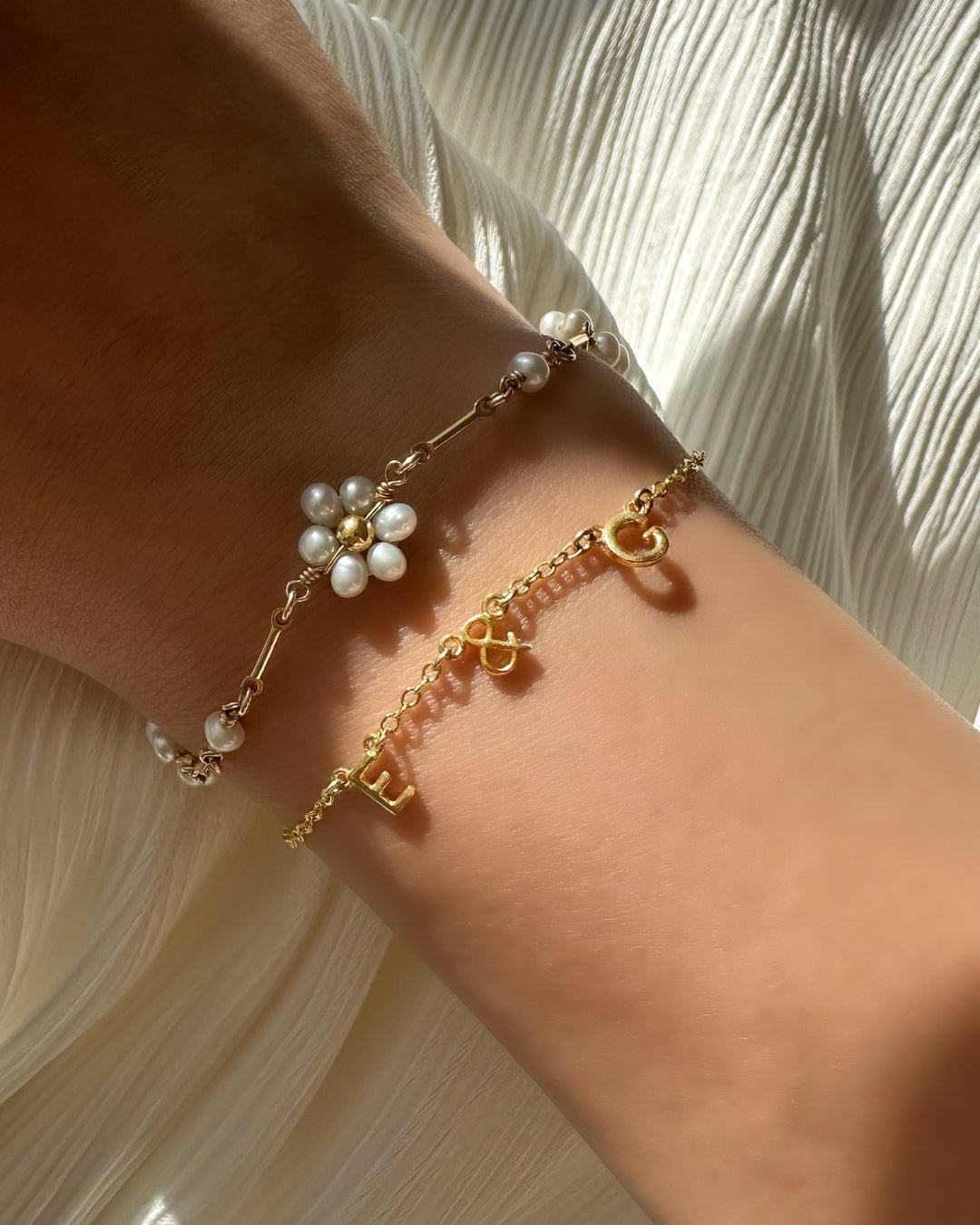 Gold You & Me Initial Bracelet – Dainty 14K Gold Letter Bracelet with Petite 5mm Initials on a model. Personalized Jewelry for Couples, Best Friends, or Family. Minimalist Custom Gift.