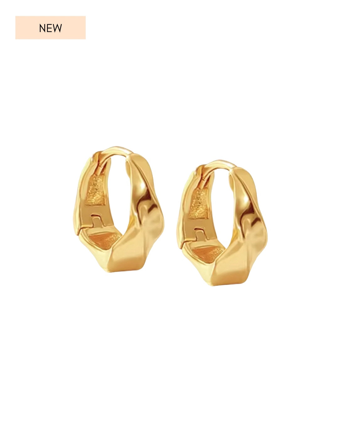 Pair of gold vermeil molten huggie hoop earrings on a white background