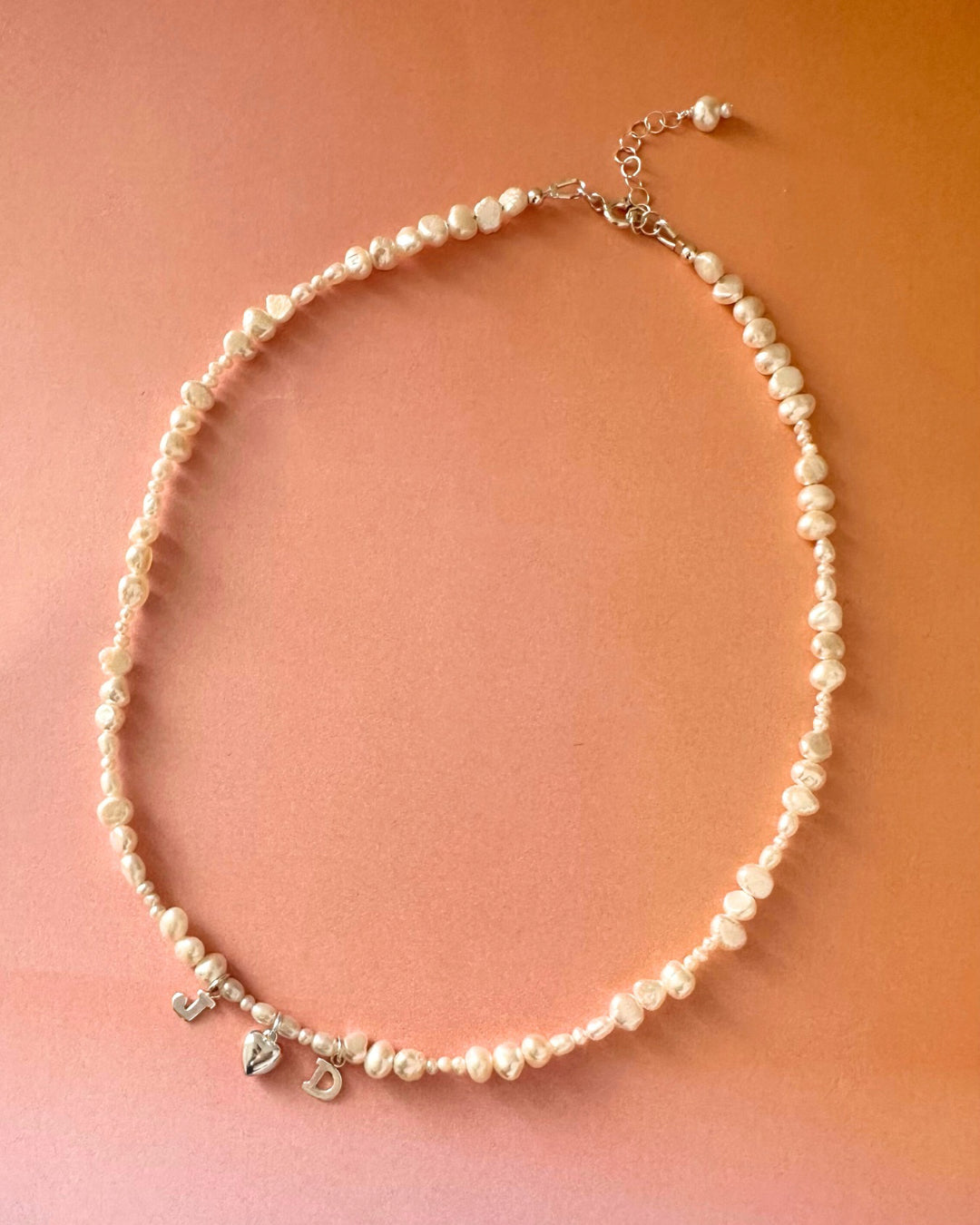 Sterling silver Classic Pearl Initial Choker with organic freshwater pearls and customisable initials, puffy heart or mini pearl charms.