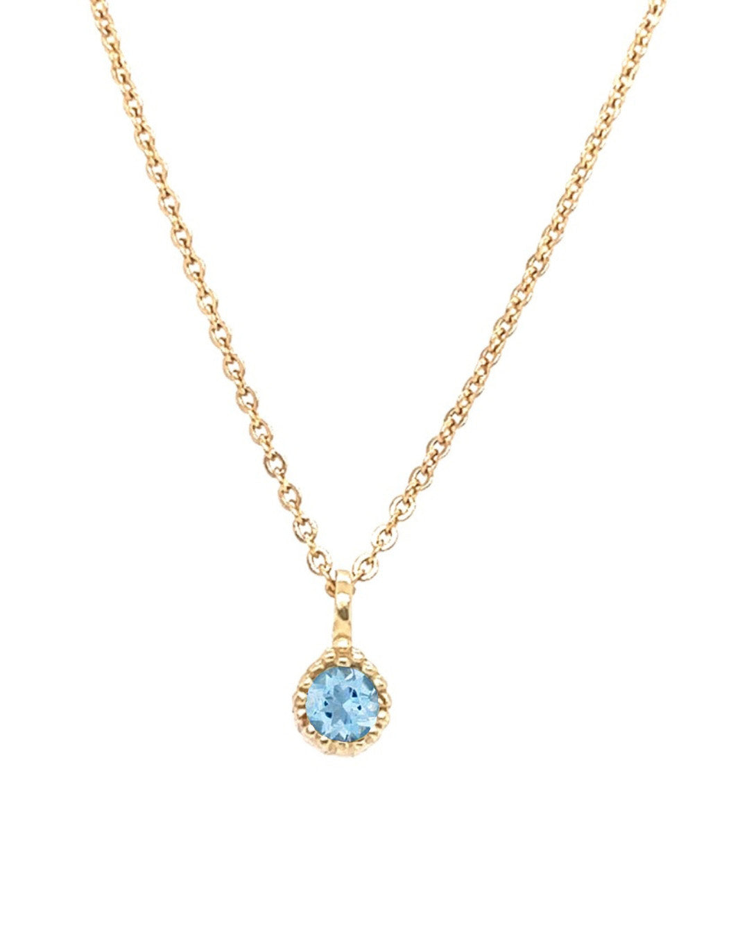 Gold birthstone necklace with a blue topaz gemstone pendant on a white background