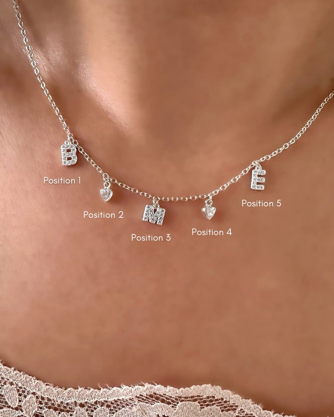 See how it looks: Necklace shows 5 charms (B ♡ M ♡ E)