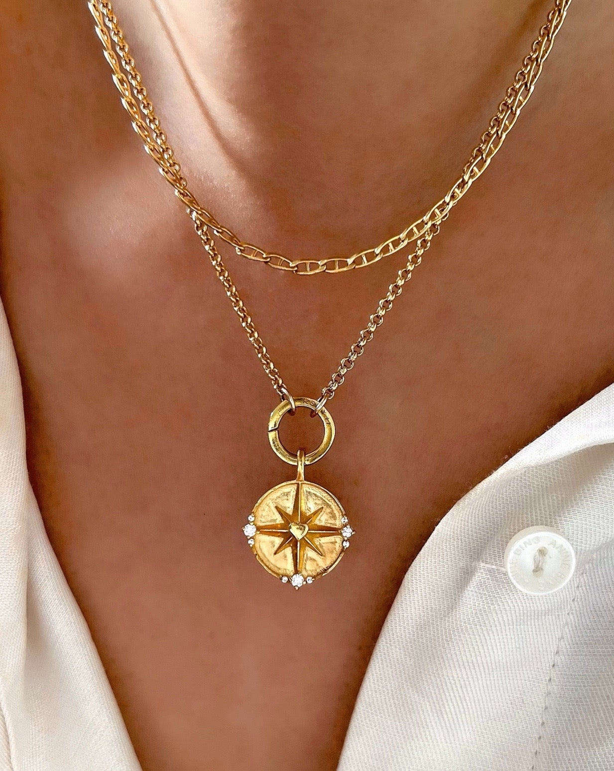 Gold petite Rolo annex link clasp necklace chain with dreamers North Star pendant on a model