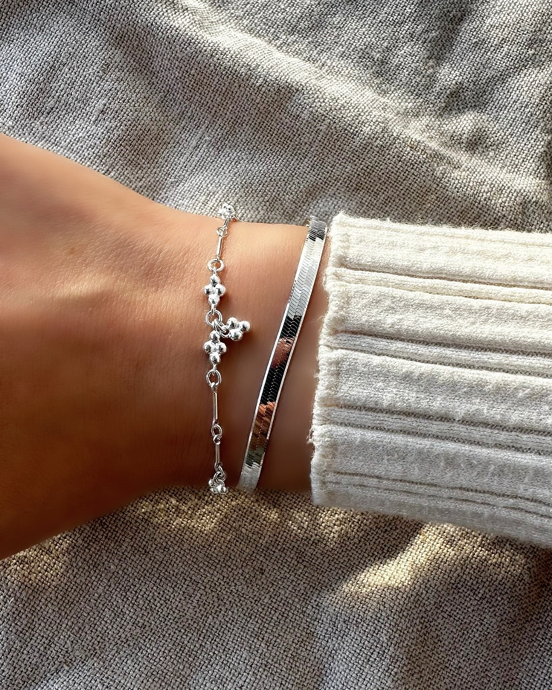 Sterling silver mini spheres trinity ball satellite bracelet on a model