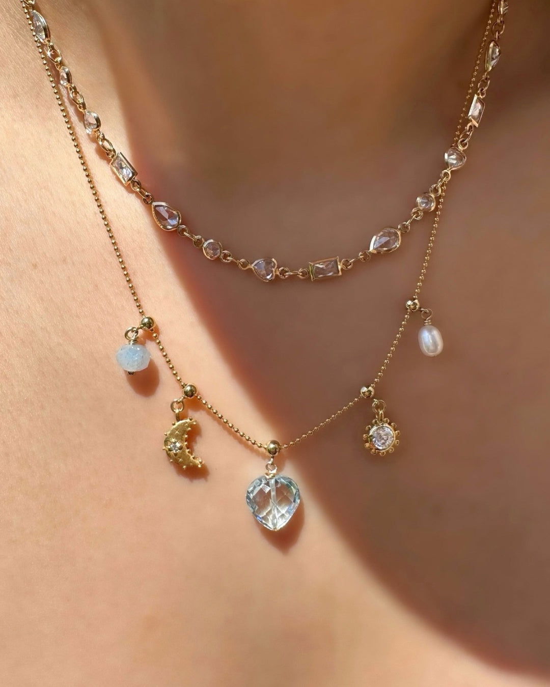 Model wearing 14k gold fill Luna Crescent Moon Charm on a Charm Story Necklace