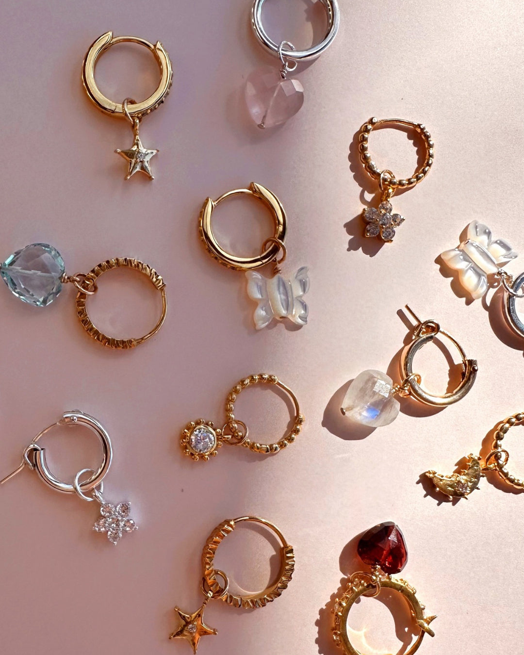 Close-up of the Nova star earring charm in 14k gold fill, approximately 7mm in size, designed to fit all hoops in the Mix and Match Earrings collection. Star design symbolising hope, guidance, and infinite possibilities.