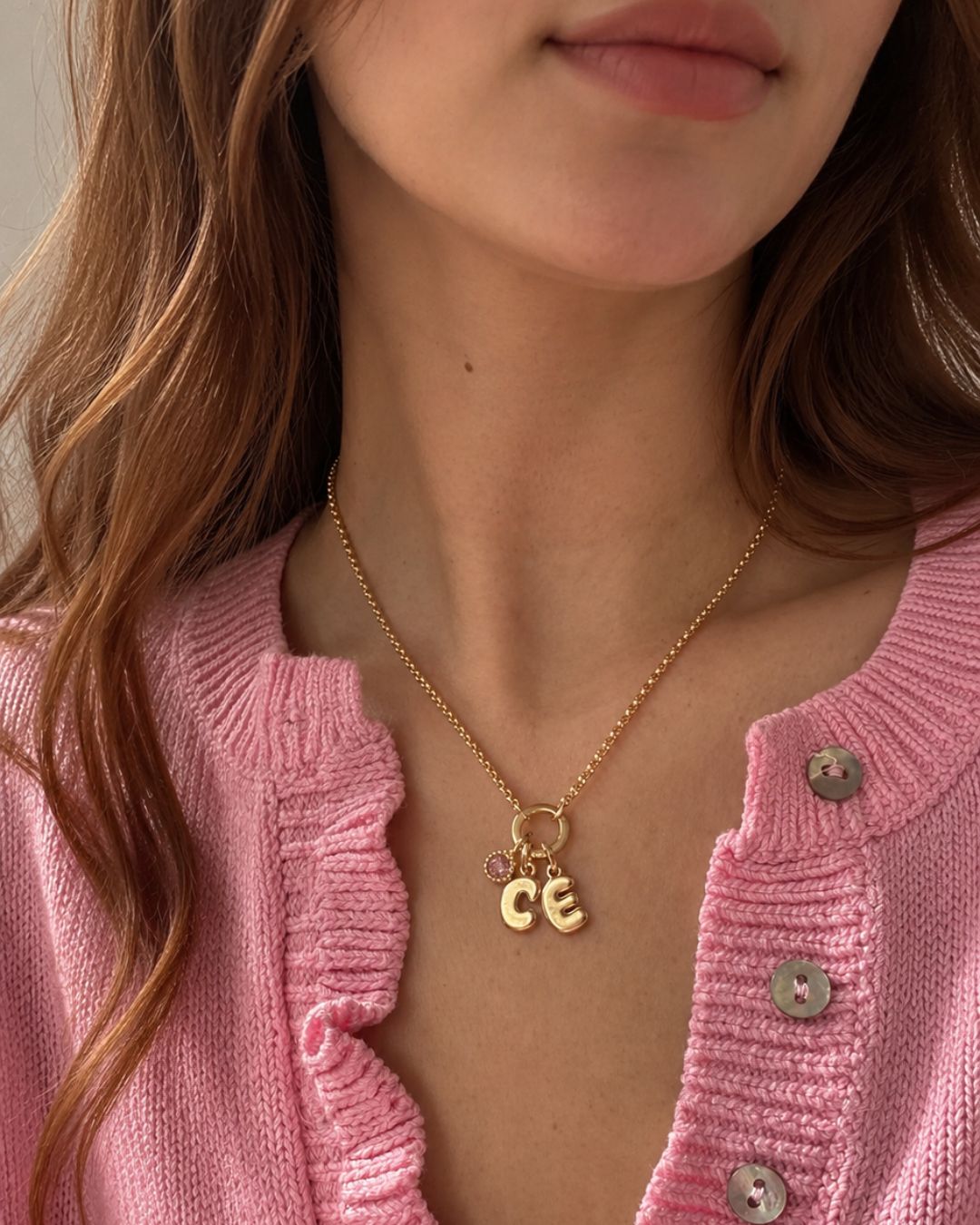Model wearing the Petite Rolo Charm Holder Necklace with Initial C, E and October (Tourmaline Pink) birthstone pendant charms.