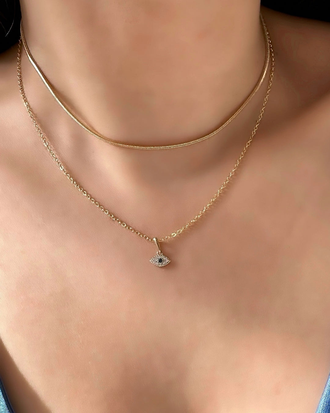 14k solid gold talisman necklace chain with evil eye pendant on a model