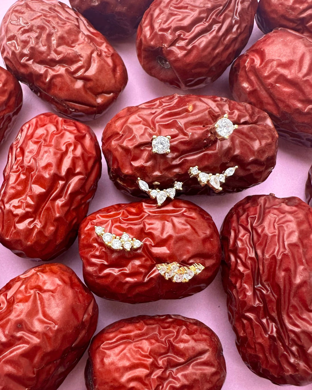 Gold climber stud earrings with a curved linear cluster of brilliant round crystals and Fleck Ear Jacket Earrings