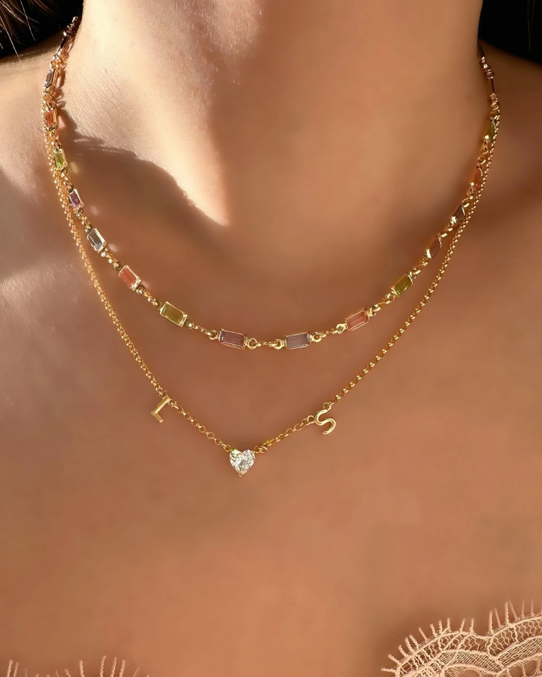 Model wearing gold Petite Capri Necklace and Petite Duo Initial Necklace