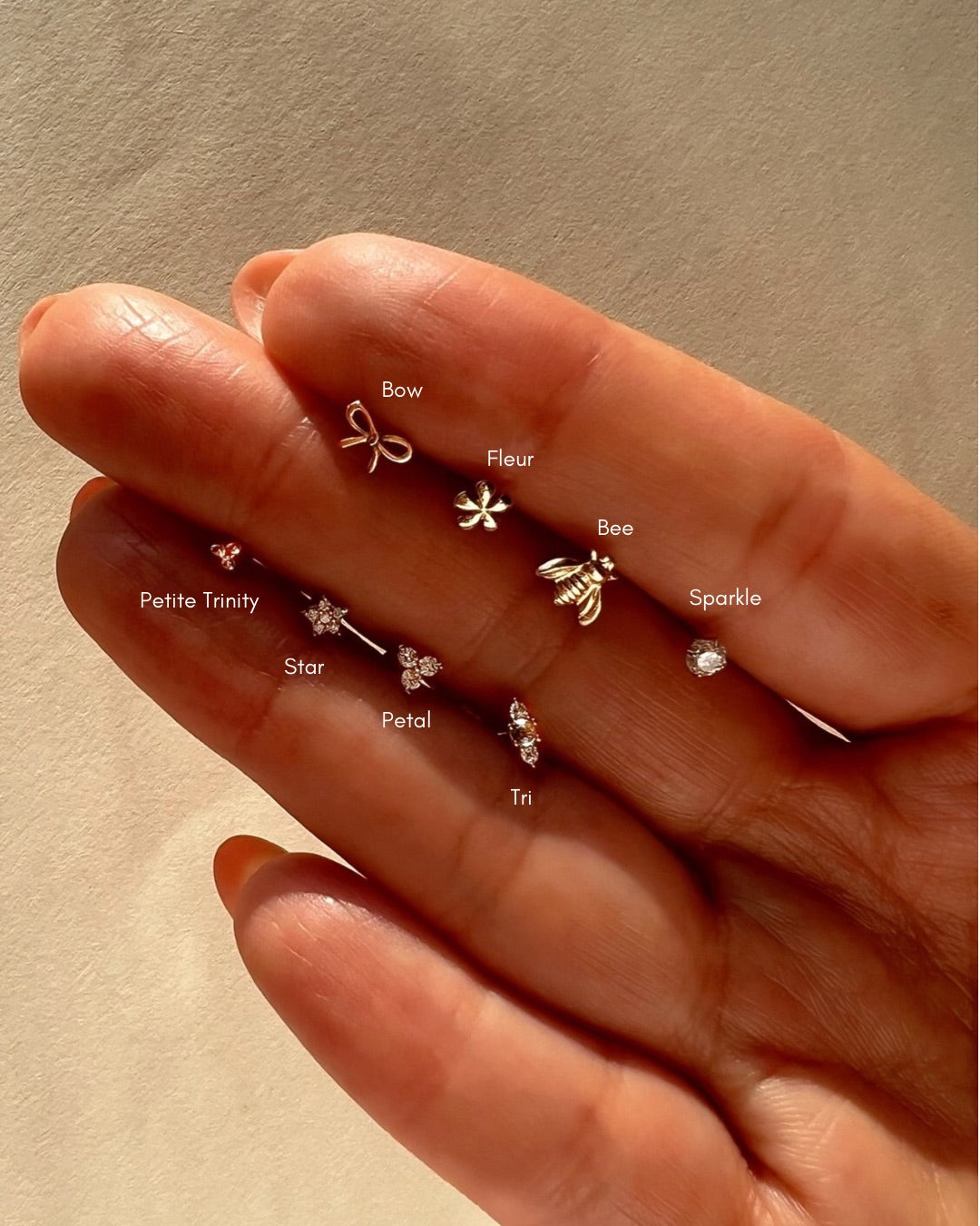 14k solid yellow gold bow stud earrings with butterfly backing. Made in Australia. Dainty, minimal, coquette, ribbon.