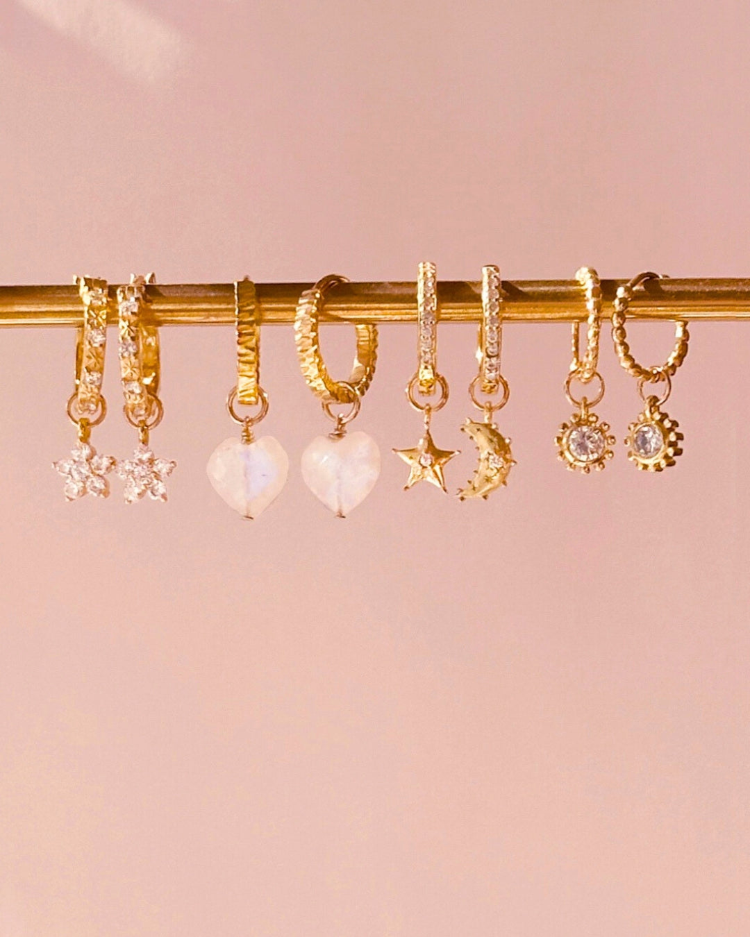 Close-up of the Luna moon earring charm in 14k gold fill, approximately 9mm in size, designed to fit all hoops in the Mix and Match Earrings collection. Celestial moon design symbolising mystery, intuition, and new beginnings.