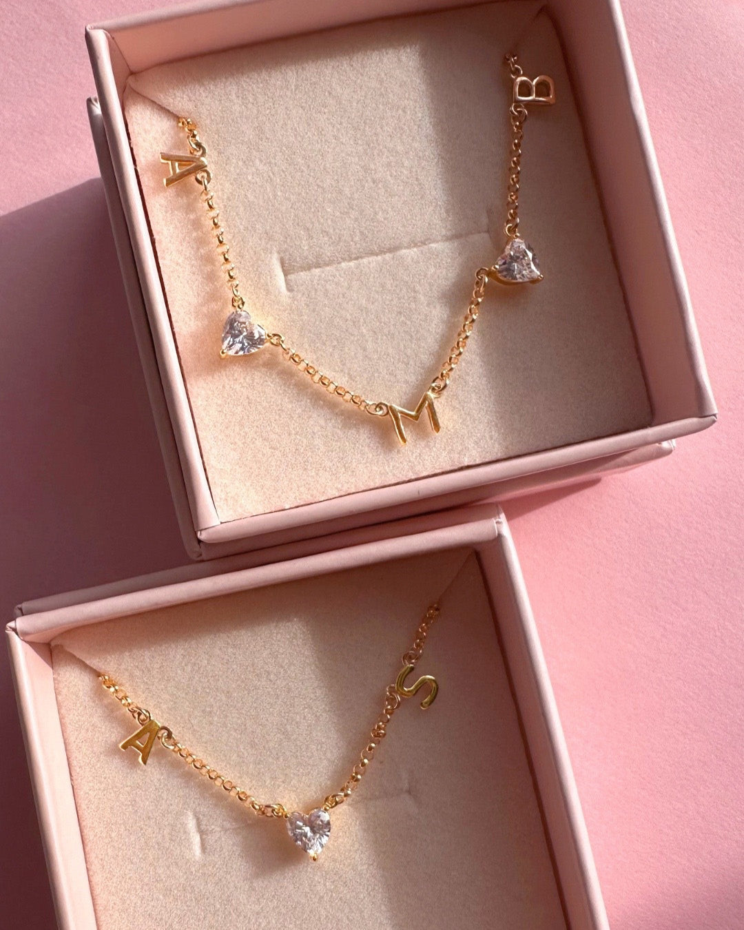 Story Trio Initial Necklace (3 letters) and Classic Petite Initial Necklace (2 letters) in Romyli gift boxes — 14k gold fill personalised jewellery from Australia