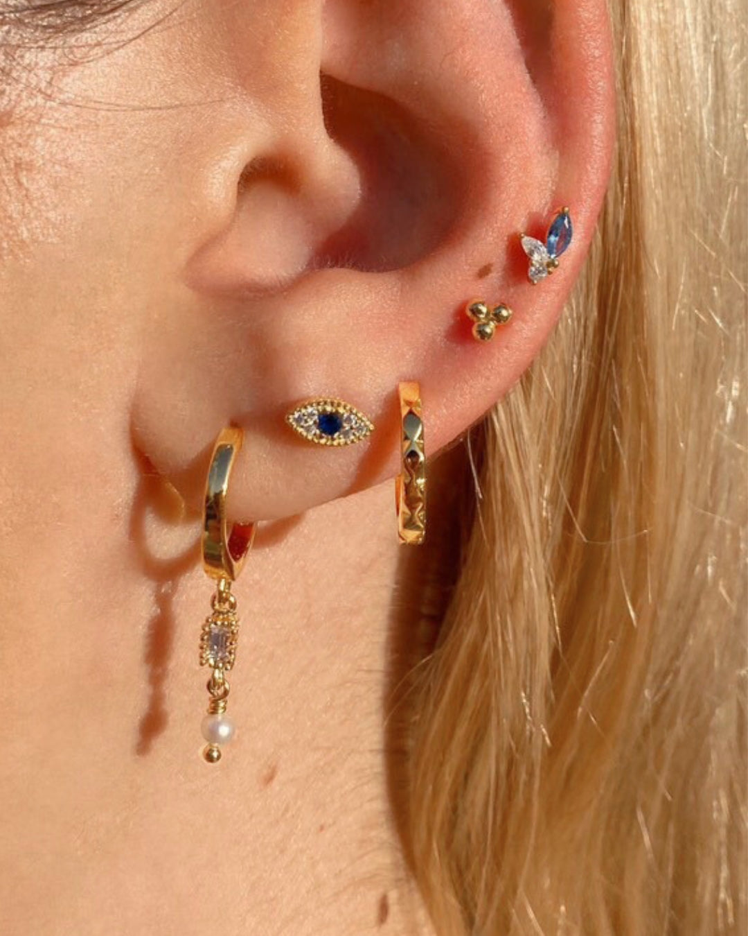 Gold Vela Hoops on a model