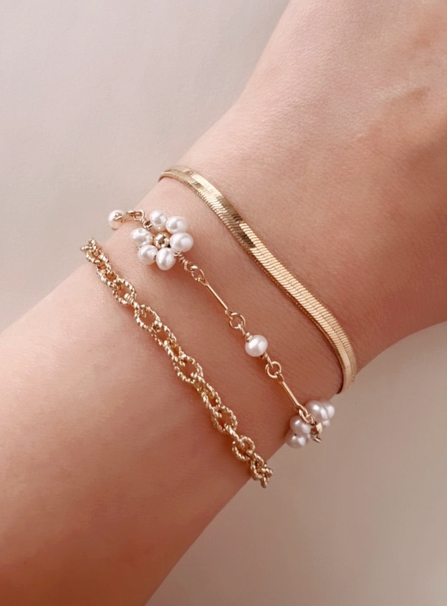 Gold Daisy Pearl Bracelet on a model 