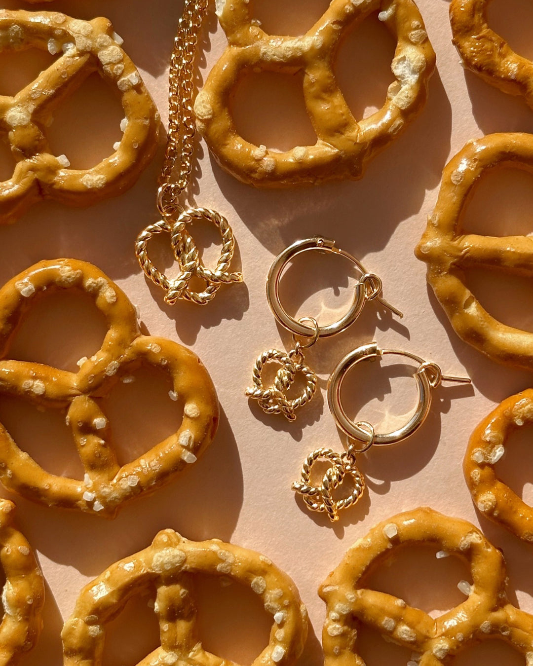 14k yellow gold fill pretzel heart pendant on a gold Rolo necklace chain