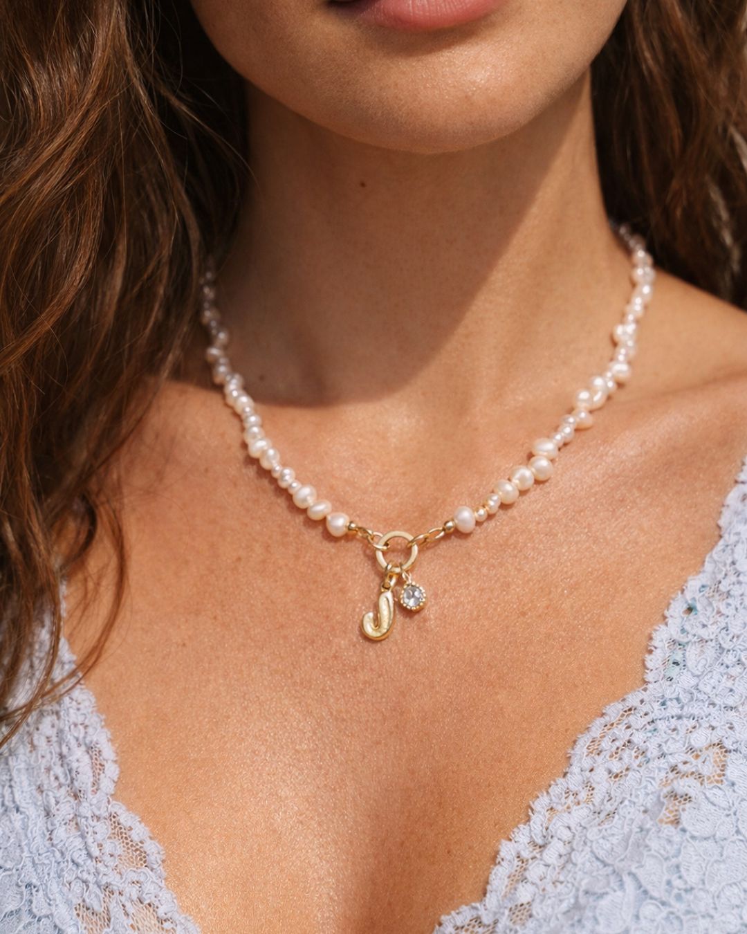 Pearl Pendant Ring necklace with a gold bubble initial and birthstone pendant charms worn by a person