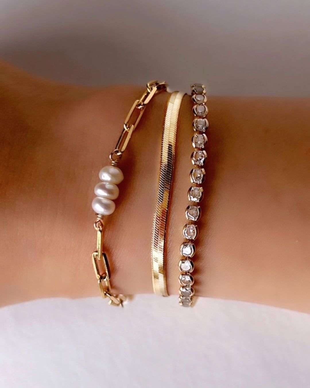 Handcrafted pearl link bracelet with trio of freshwater pearls interspaced on a dainty paperclip chain, designed in Melbourne, Australia. Elegant, timeless pearl bracelet for layering or solo wear.