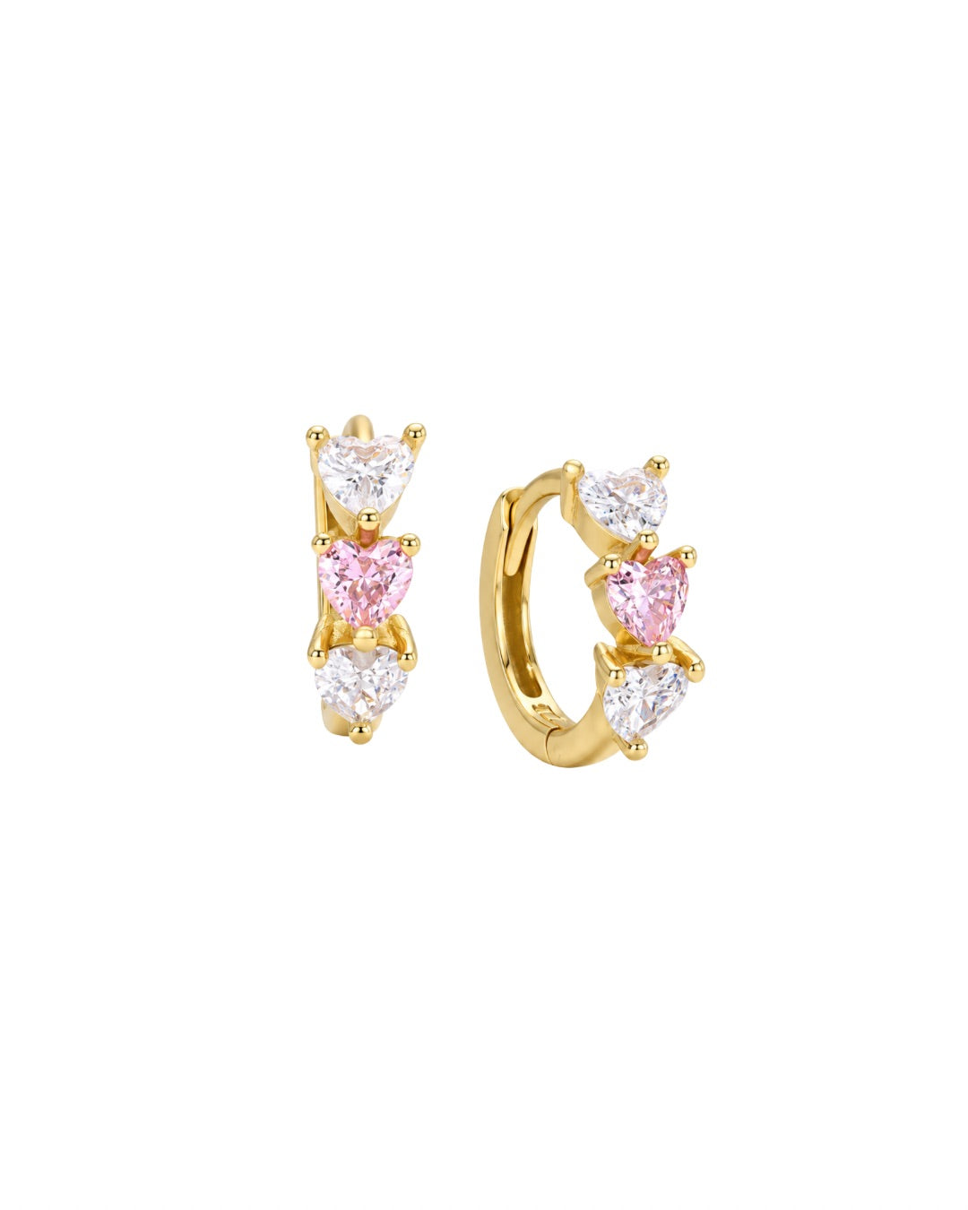 A pair of gold huggie hoop earrings decorated with three heart-shaped gemstones in each earring, featuring a central pink heart and clear heart gemstones on either side, set against a plain white background.