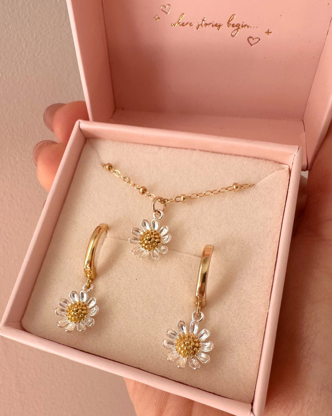 Daisy Bloom jewellery collection by Romyli, featuring dainty gold and silver necklaces, hoops in a Romyli gift box.