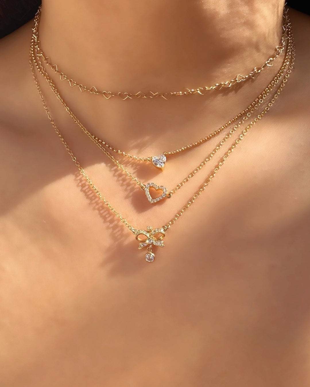 Gold vintage bow necklace with crystal-encrusted design and crystal drop, made in Australia; perfect Valentine's Day gift, birthday gift, or bridal jewelry. Coquette jewellery