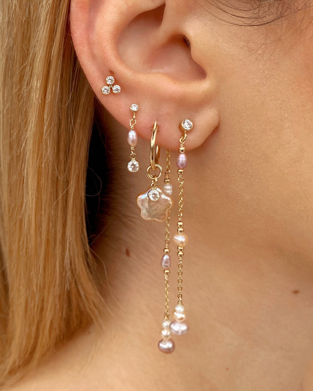 14k gold fill Freshwater Pearl charm hoops earring with bezel charms on a model
