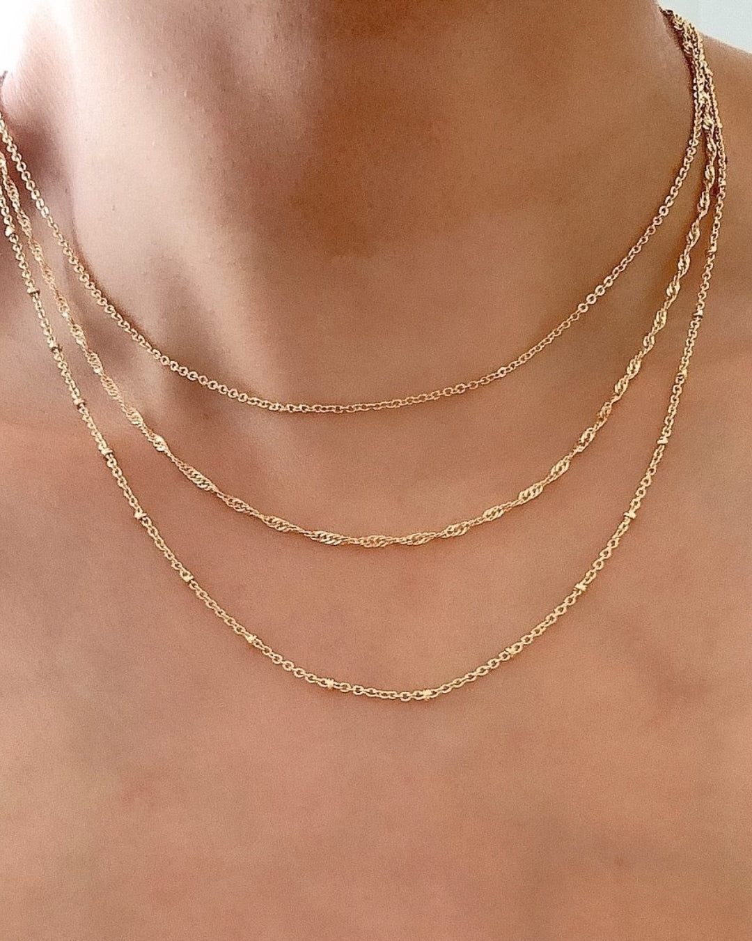 14k yellow gold fill singapore rope chain necklace on a model