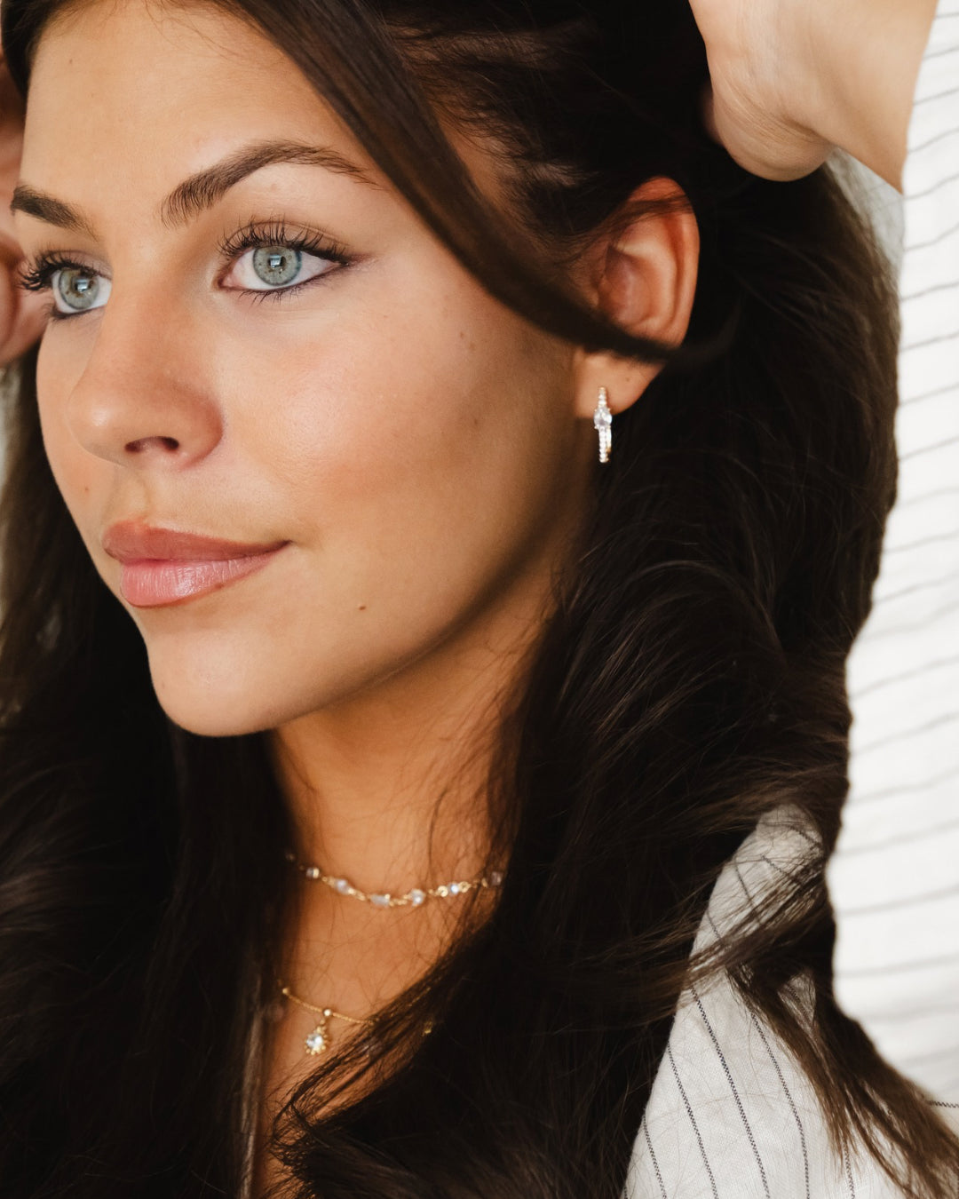 Gold cubic zirconia square pave hoop earrings. Australia.