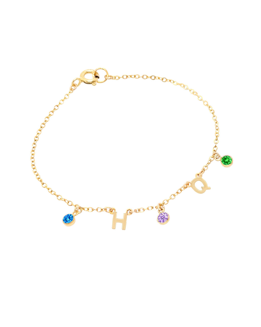 A delicate gold initial birthstone bracelet, customisable with up to 9 initials and birthstones, elegantly set on a fine gold chain. A timeless and meaningful piece for everyday wear and gifting.