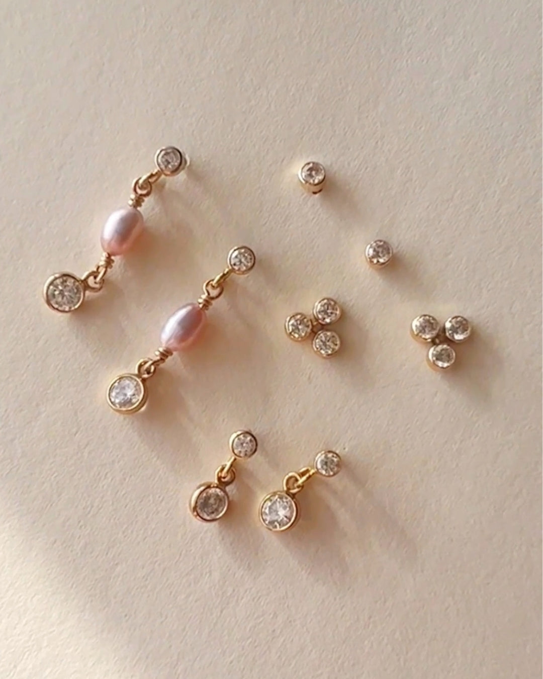 14k yellow gold fill freshwater pearl drop earring studs on a model