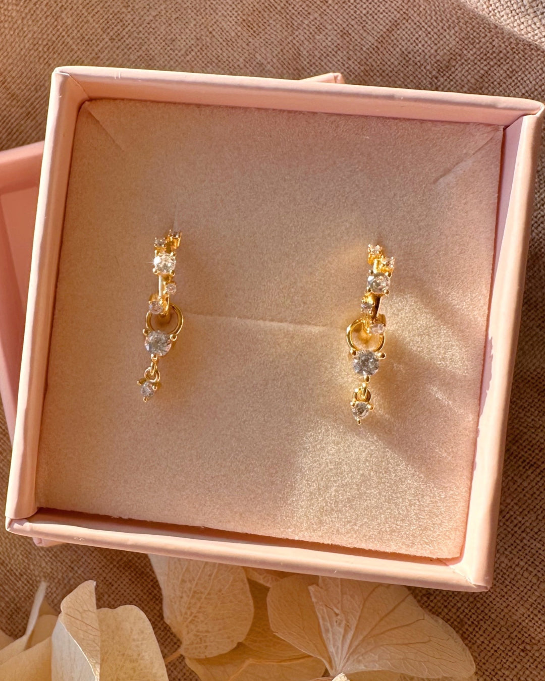 Dainty Stellar Cluster Huggies with alternating organic crystal design along the front in a Romyli gift box