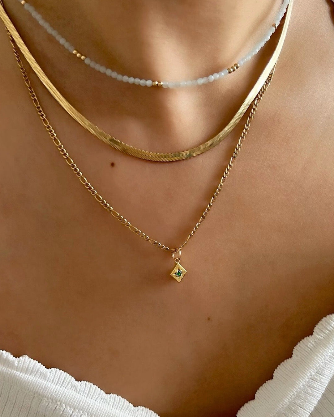 14k gold fill Asteria star mini pendant charm with green emerald cubic zirconia diamond crystal. Made in Australia. May Birthstone pendant.