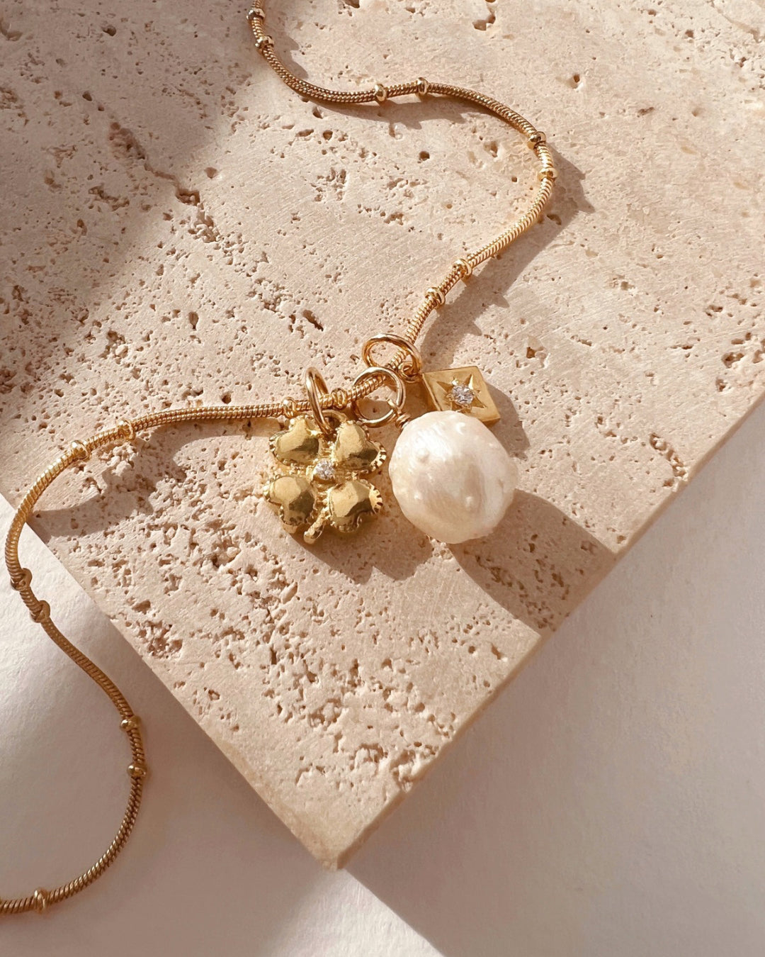 14k gold fill Asteria star mini pendant charm with cubic zirconia diamond crystal. Made in Australia. April Birthstone pendant.