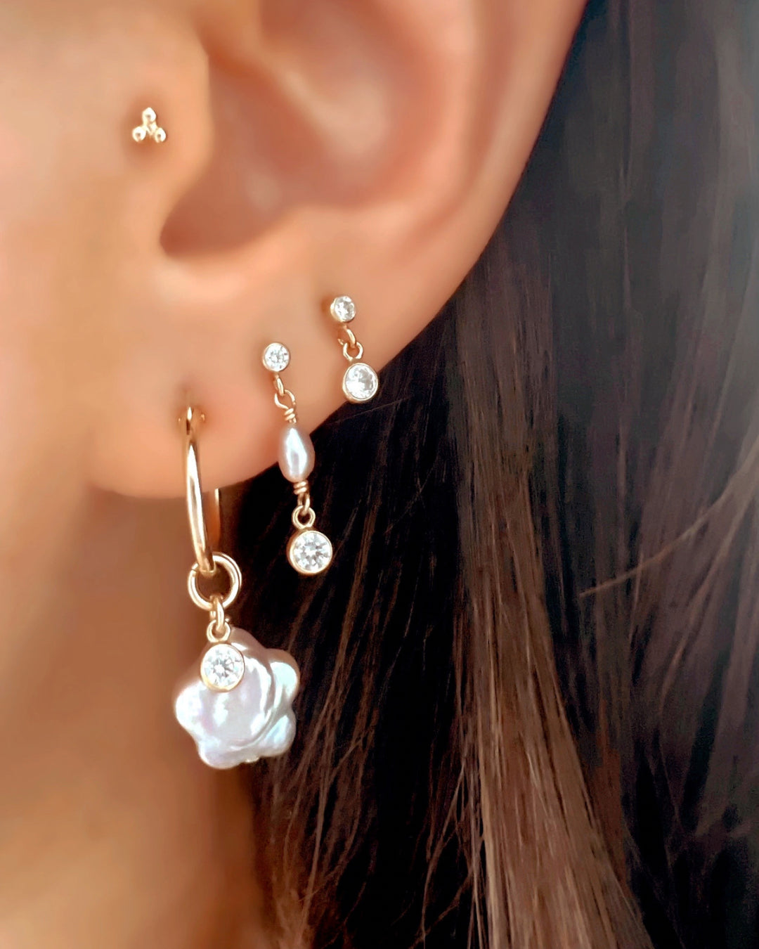 14k yellow gold fill freshwater pearl drop earring studs on a model