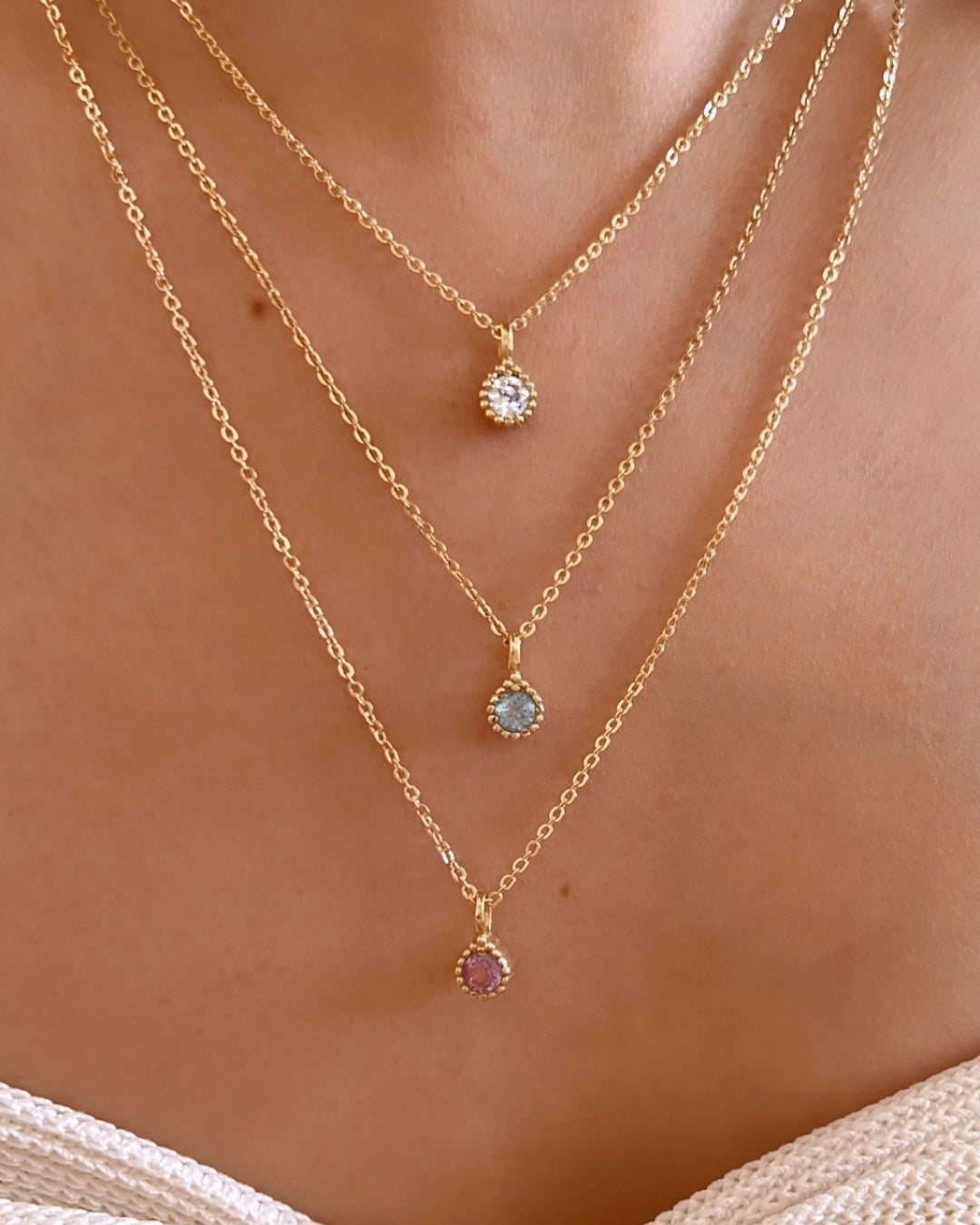14k yellow gold fill Cable chain necklace paired with birthstone pendants on a model