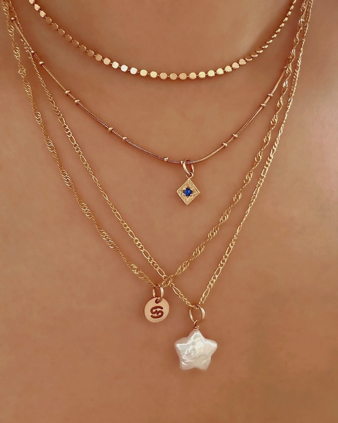 14k yellow gold fill fine Figaro chain necklace on a model