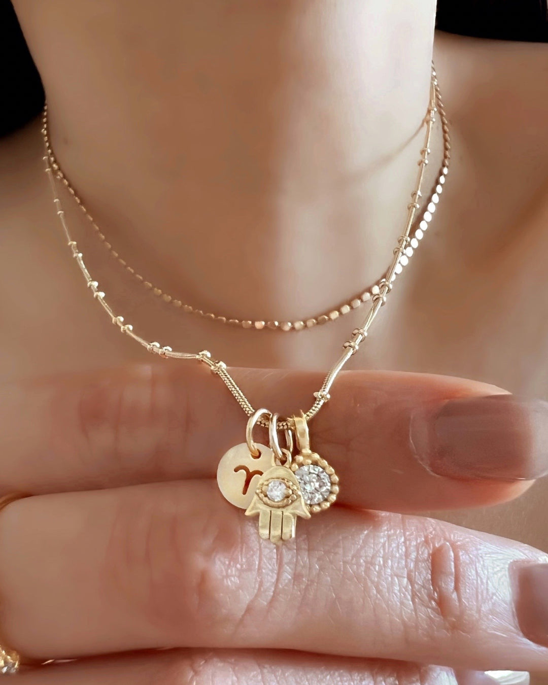 Gold beaded necklace chain in yellow gold paired with the mini zodiac, hamsa and birthstone pendant.