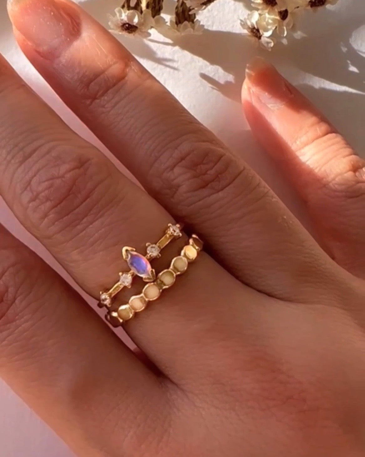 14k gold fill moonstone marquise ring with marquise shaped moonstone and 4 micro pave cubic zirconia crystals on a model