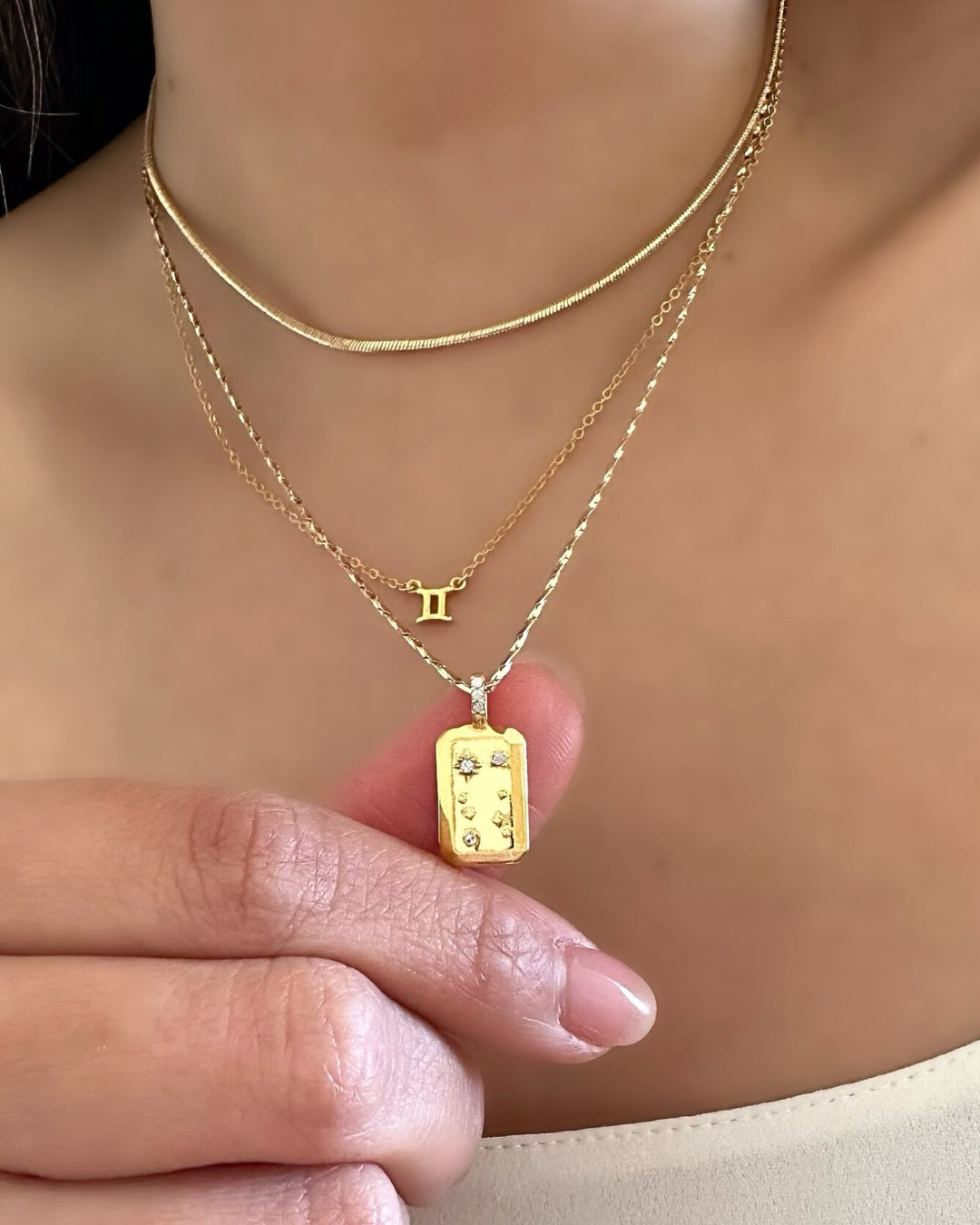 Gold Gemini Constellation Zodiac Necklace and Gemini Zodiac Sign Necklace on a model