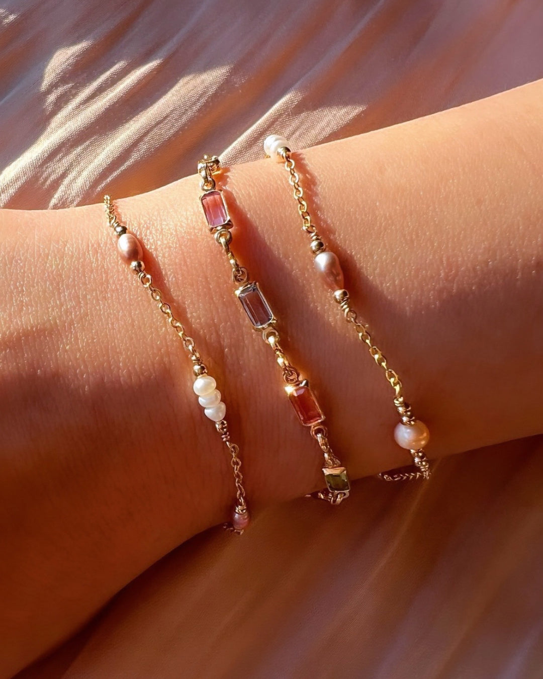 Pastel coloured freshwater pearl bracelets with gold Capri bracelet