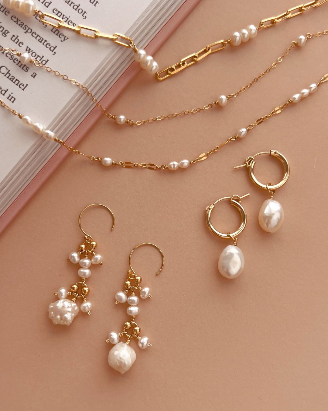 Gold freshwater pearl earring charm on gold fill hoops with freshwater pearl necklaces, earrings and choker