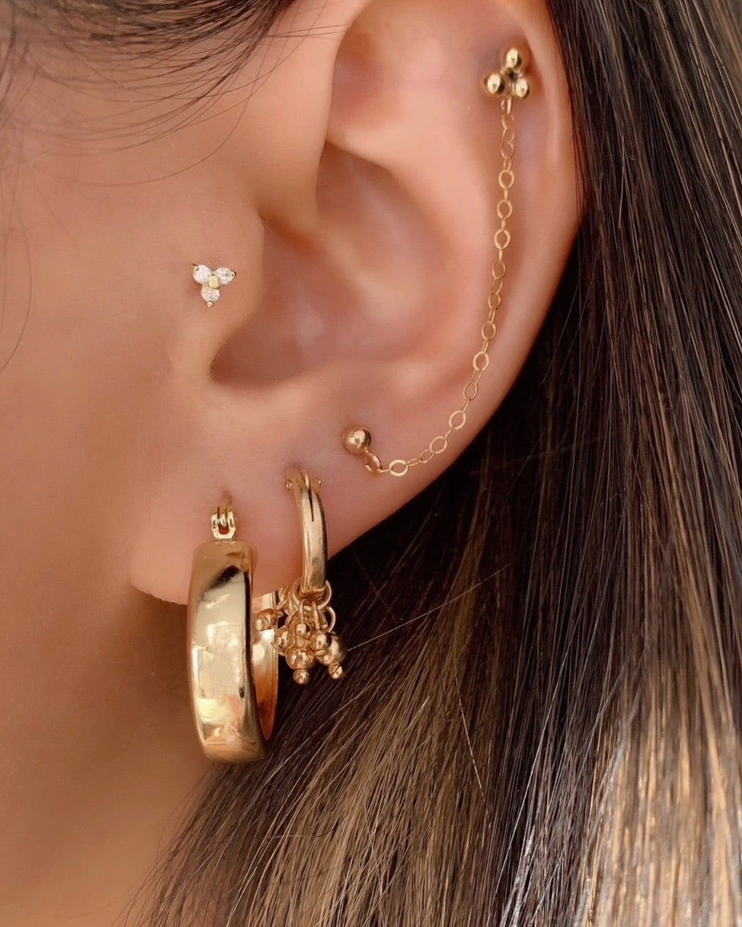 Handcrafted 14k Gold Fill Cluster Bead Hoops Earrings on a model. Made in Australia
