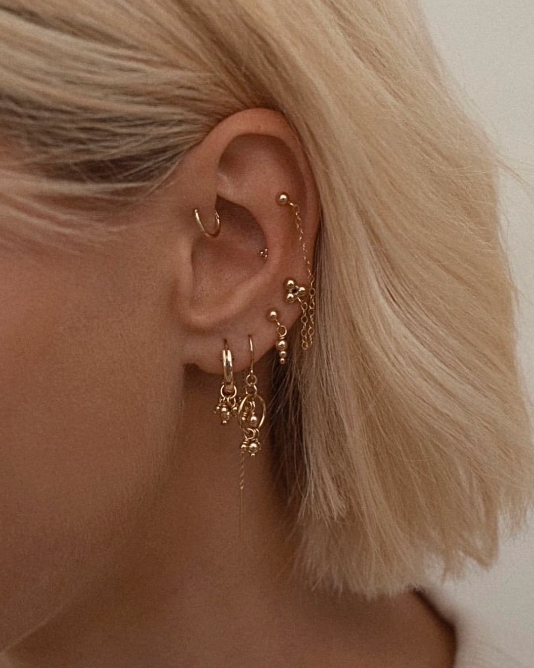 Handcrafted 14k Gold Fill Cluster Bead Hoops Earrings on a model. Made in Australia