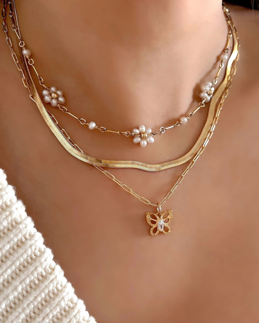 Gold Serpentine Herringbone Necklace on a model