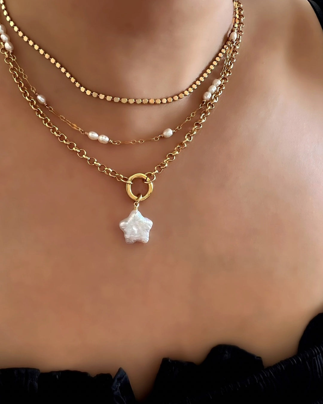 14k gold fill freshwater pearl star pendant charm with a Rolo annex link necklace on a model