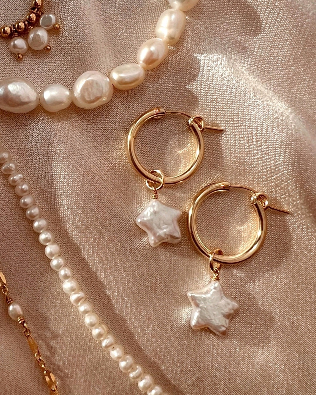 Gold freshwater Star Pearl hoop earring charm on a 14k gold fill hoops