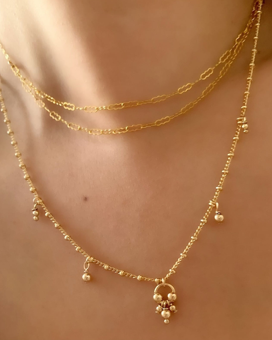 14k gold fill double strand choker necklace on a model