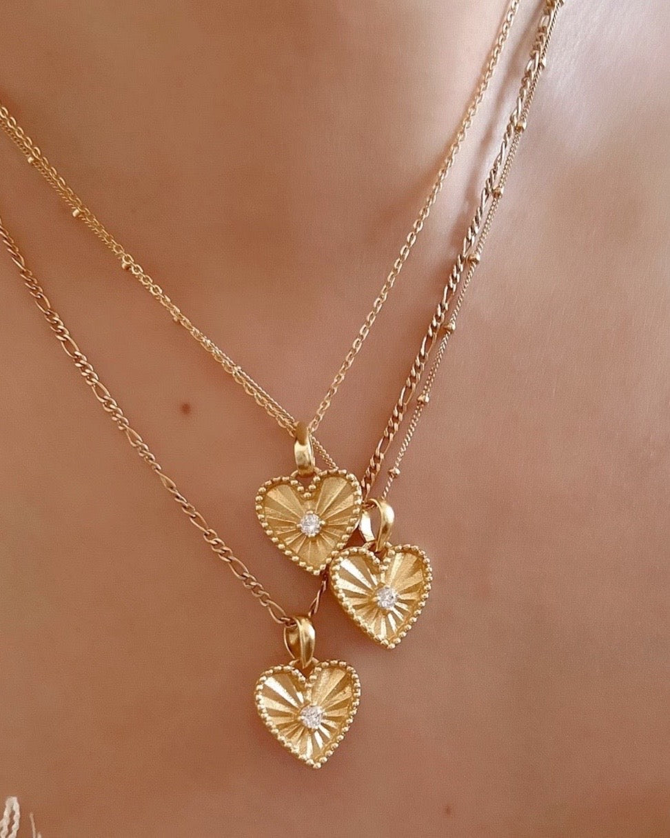 14k gold fill love heart pendant with diamond cubic zirconia centre with necklace chain on a model